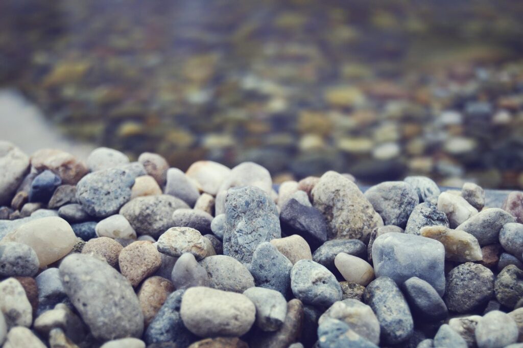 Cleaning the Planet: Natural Water Filtration close up image of large gravel
